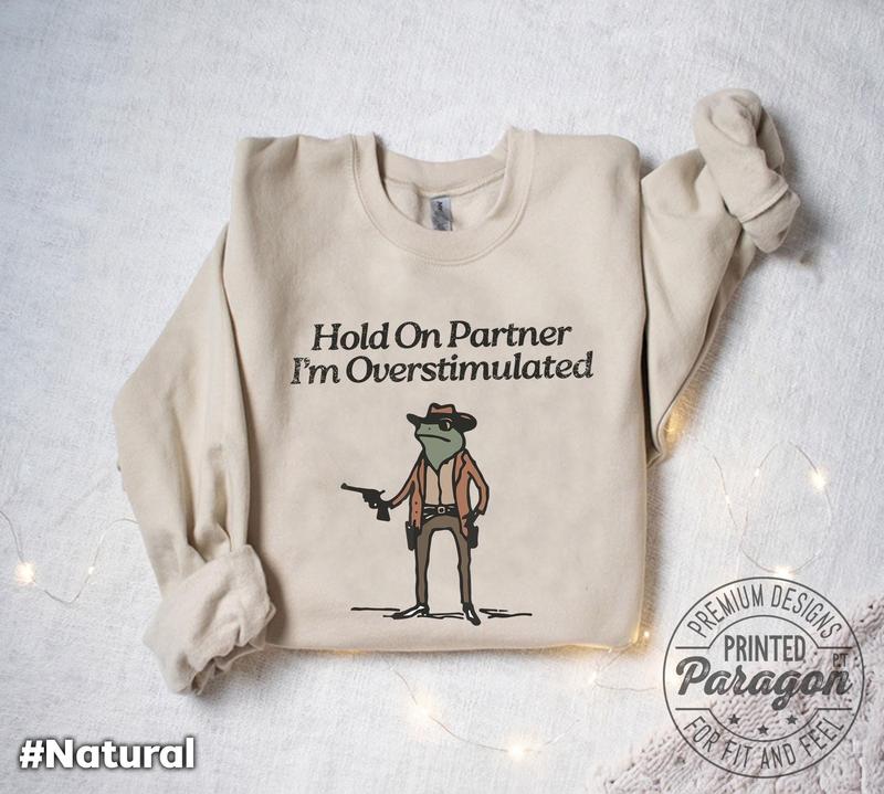 Im Overstimulated Shirt, Hold On Partner I'm Overstimulated Sweatshirt Vintage Design Style Up to 4Xl | Cowboy Frog Shirt With Funny Memes T-shirts, Crewnecks, Hoodies – Gifts Suitable for Anyone T-shirts, Crewnecks, Hoodies – Gifts Suitable for Anyone